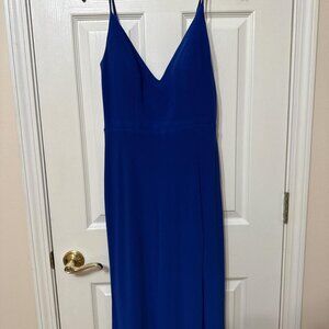 Royal blue maxi dress with spaghetti straps and a flowy, flared skirt
